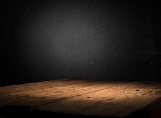 Empty wood table top on blur light gold bokeh of cafe restaurant in dark background