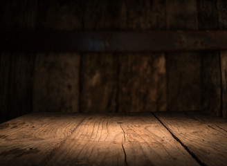 Empty wood table top on blur light gold bokeh of cafe restaurant in dark background