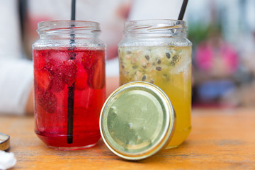 Vibrant view of traditional refreshing fruit lemonade drinks in classic jars in Jakarta, Indonesia