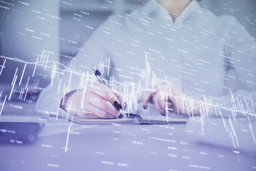 Financial chart drawn over hands taking notes background. Concept of research. Multi exposure