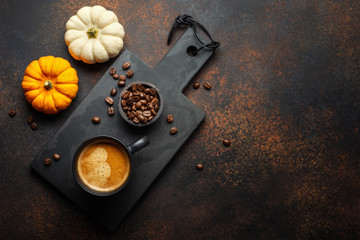 Autumn arrangement with coffee and pumpkin