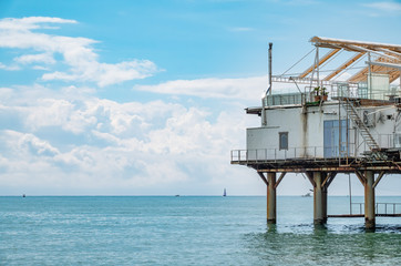 Platform on supports in the sea near the shore.
