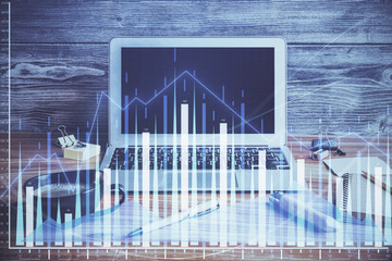 Double exposure of graph and financial info and work space with computer background. Concept of...