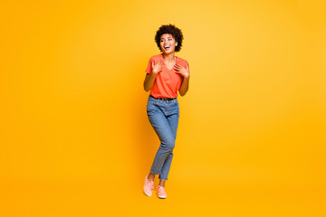 Full length body size photo of cheerful curly wavy black lady wearing jeans denim unable to believe...