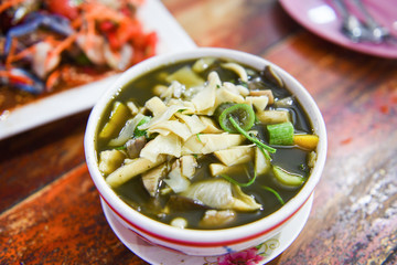bamboo shoot soup and mushroom herbs and spices ingredients Thai food served on table / Tradition...