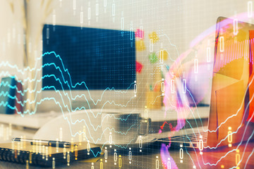 Financial market graph hologram and personal computer on background. Double exposure. Concept of forex.