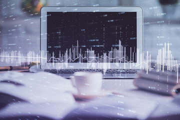 Forex market graph hologram and personal computer on background. Double exposure. Concept of investment.