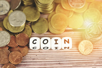 Coins on table / Pile of Golden coin, silver coin and copper coin on wooden money financial concept