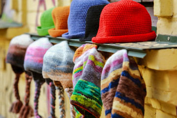 variety of knitted hats at the fair