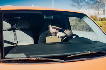 Urgent courier messenger in his orange van