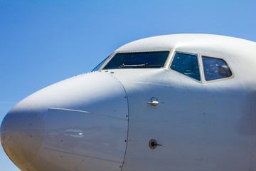 white airplane  cockpit with blue sky