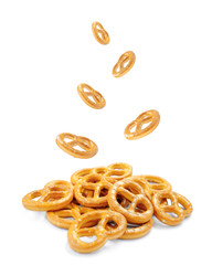 Pretzel with many small cookies scattered on a white background. Traditional food for Oktoberfest - salt appetizer pretzels on a white background. German pretzel (Bretzel), Oktoberfest.