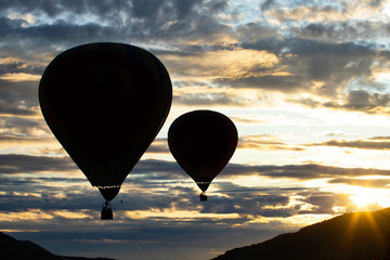 Hot air balloon over blue sky.