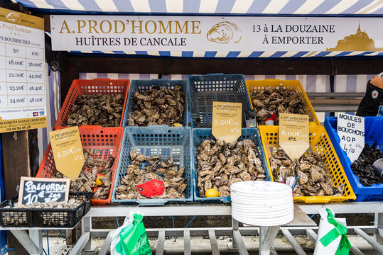 A prod&acute;Homme crates with fresh oysters for sale in Cancale