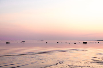 Great fond pink sea dusk with silhouettes. Great view spring sea view.