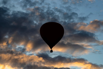 Hot air balloon over blue sky.