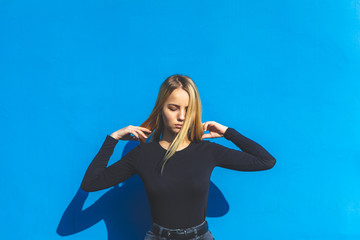 Blonde woman on summer blue background