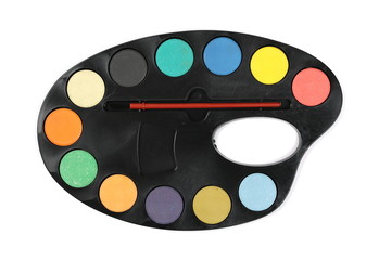 Clean, new watercolor palette with brush isolated on white background