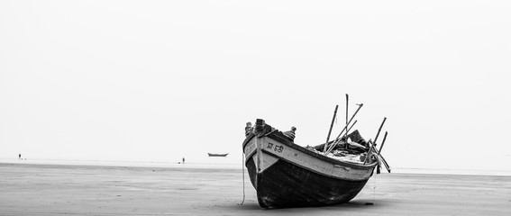 A boat in the shore , a fine art