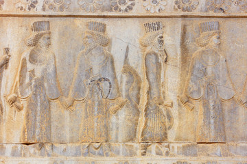 Image of ancient Persian ambassadors. An ancient relief on the walls of the ruined city of Persepolis. Persepolis. Iran.