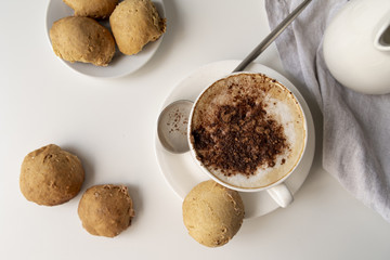 Top view cup of coffee and sweets