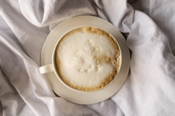 Delicious cup of coffee with cream