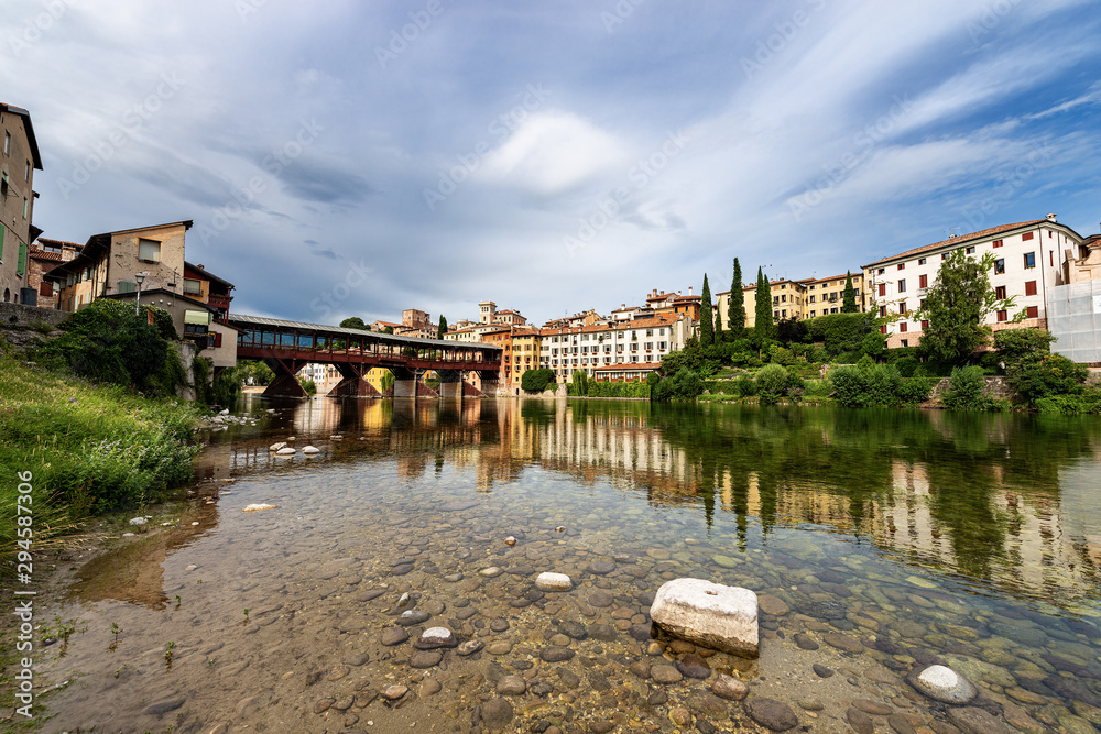 Wall mural bassano del grappa with the river brenta and the ponte degli alpini (bridge of the alpini). vicenza 