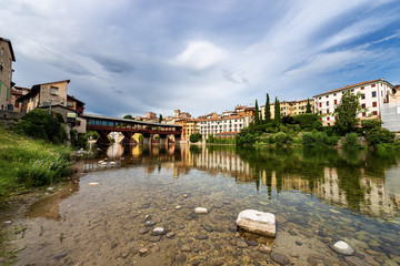 Obraz premium Bassano del Grappa with the river Brenta and the Ponte degli Alpini (Bridge of the Alpini). Vicenza province, Veneto, Italy, Europe