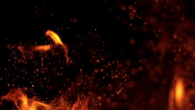 Super slow motion of fire sparks isolated on black background. Filmed on high speed camera, 1000 fps