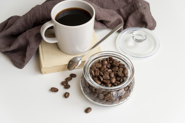 Cup of coffee and coffee beans