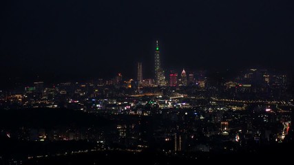 TAIPEI, TAIWAN - CIRCA AUGUST 2019 : Aerial view of sunrise cityscape of Taipei. View around shopping and business district at Xinyi area. Time lapse shot, night to morning.