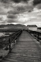 Wooden boardwalk along the beach in Isla Plana village