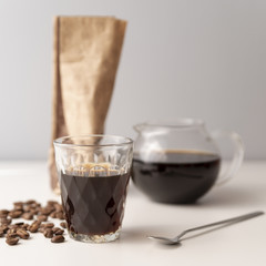 Glasses of coffee with coffee beans