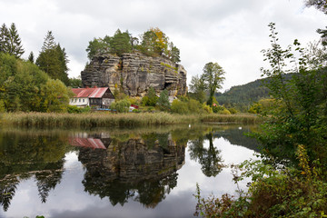 Impregnable medieval rock castle Sloup from the 13th century with Castle pond in northern Bohemia, Czech Republic