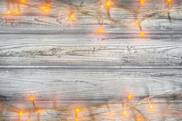 Christmas garland on wooden background with copy space