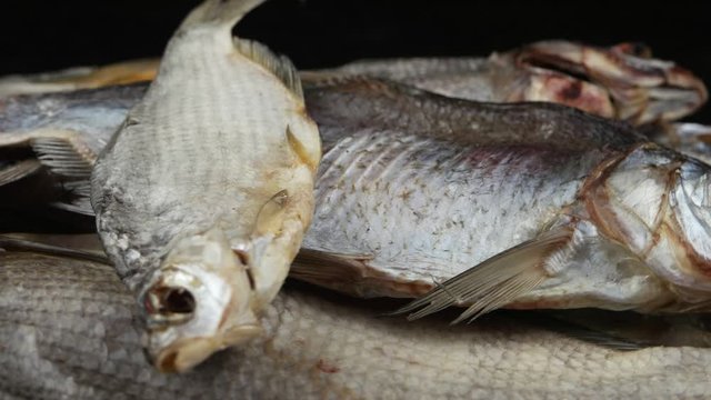 Freshwater dry fish, sun-dried bream and roach, background