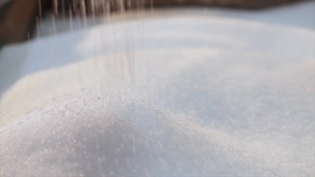 Polypropylene granules fall in slowmotion. Polypropylene granular raw materials