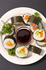 maki-sushi and soy sauce, top view