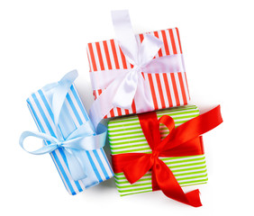 Top view of pile of christmas gifts on white background