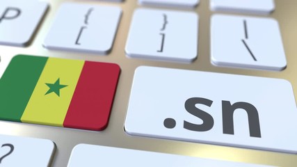 Senegalese domain .sn and flag of Senegal on the buttons on the computer keyboard. National internet related 3D animation - Powered by Adobe