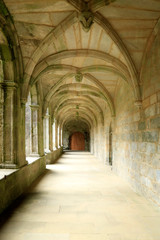 Fototapeta na wymiar Hall of arches in monastery cloister