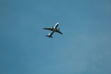 Fototapeta na wymiar the airplane passenger is flying through the blue sky