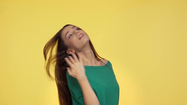 Woman Dancing And Walking Away Isolated On Yellow