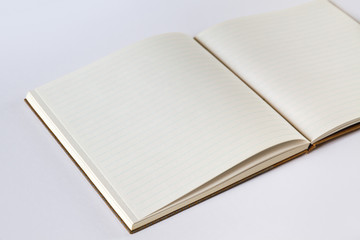 Open blank notebook closeup view