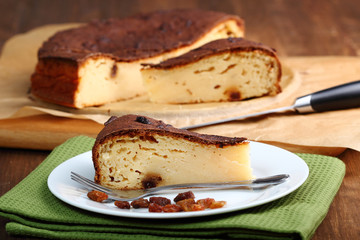 Slice of Cheesecake with raisins on plate