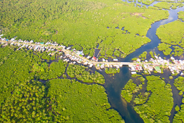 Town on the water and mangroves, top view. Coast of the island of Siargao. Tropical landscape.
