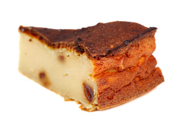 Slice of Cheesecake with raisins. Isolated on a white background