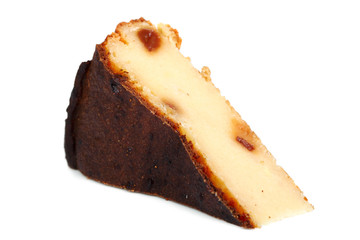 Slice of Cheesecake with raisins. Isolated on a white background