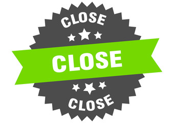 close sign. close green-black circular band label
