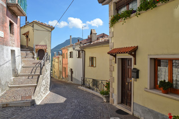 Fototapeta premium Letino, Italy, 09/23/2017. A road among the old houses of a rural mountain village.